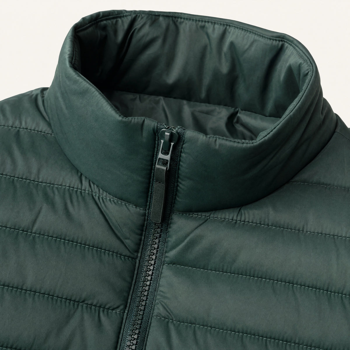 The Treeline Men's Quilted Puffer Jacket in Pine Green, detail close-up